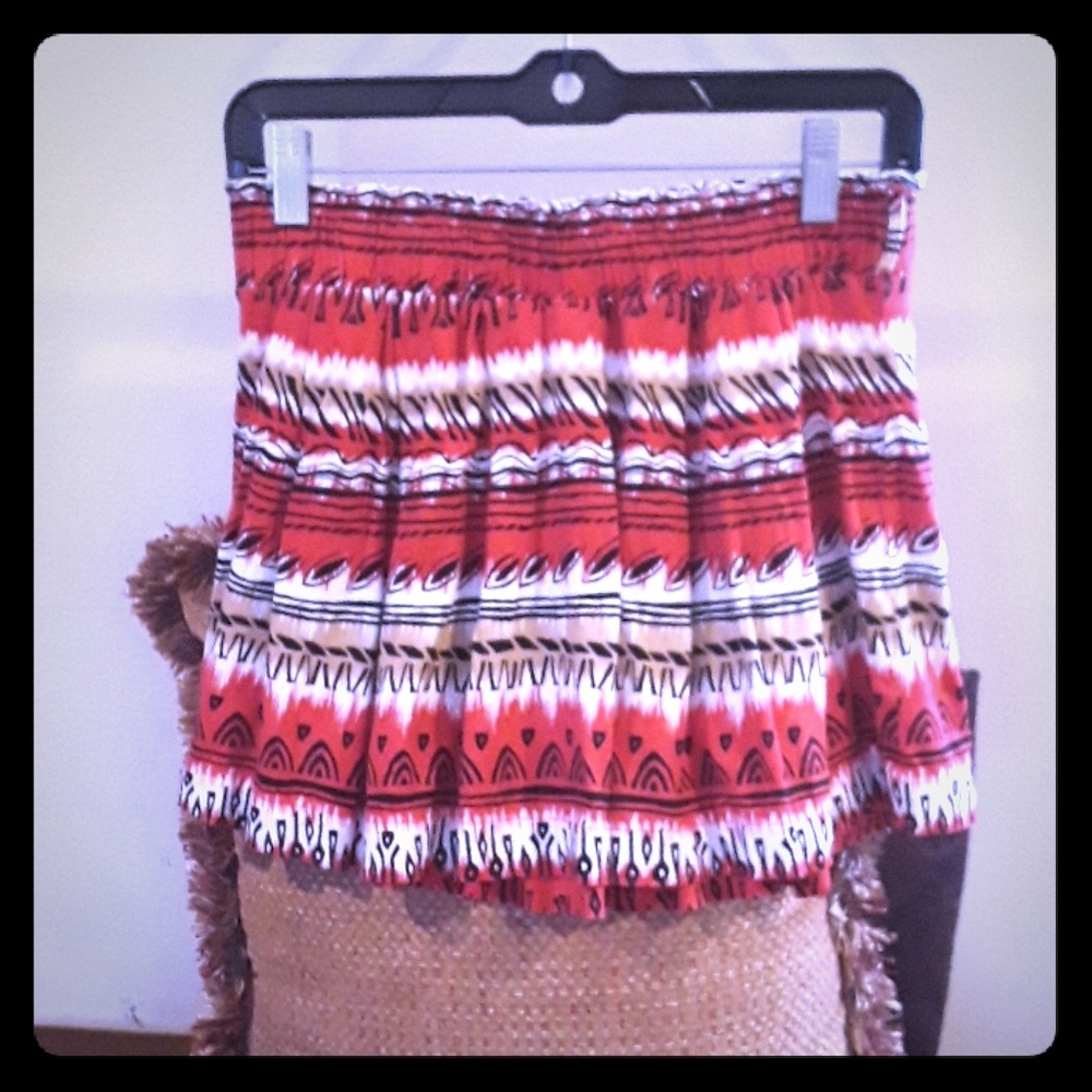 Red mini skirt with black design and beige
